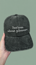 "Serious about pleasure" baseball hat in green